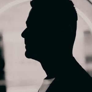 Elegant silhouette portrait of a man in profile view with monochrome artistry.